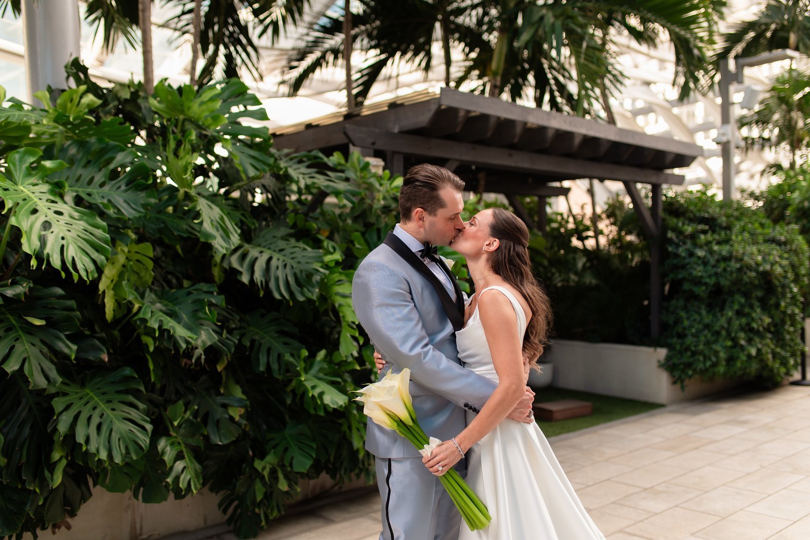 Leah and Will sharing a wedding kiss at EAST Miami, also known as East Hotel, in Brickell