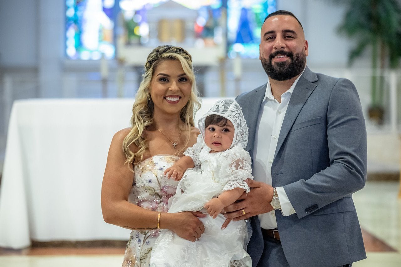 Amira with her parents during her South Florida baptism celebration