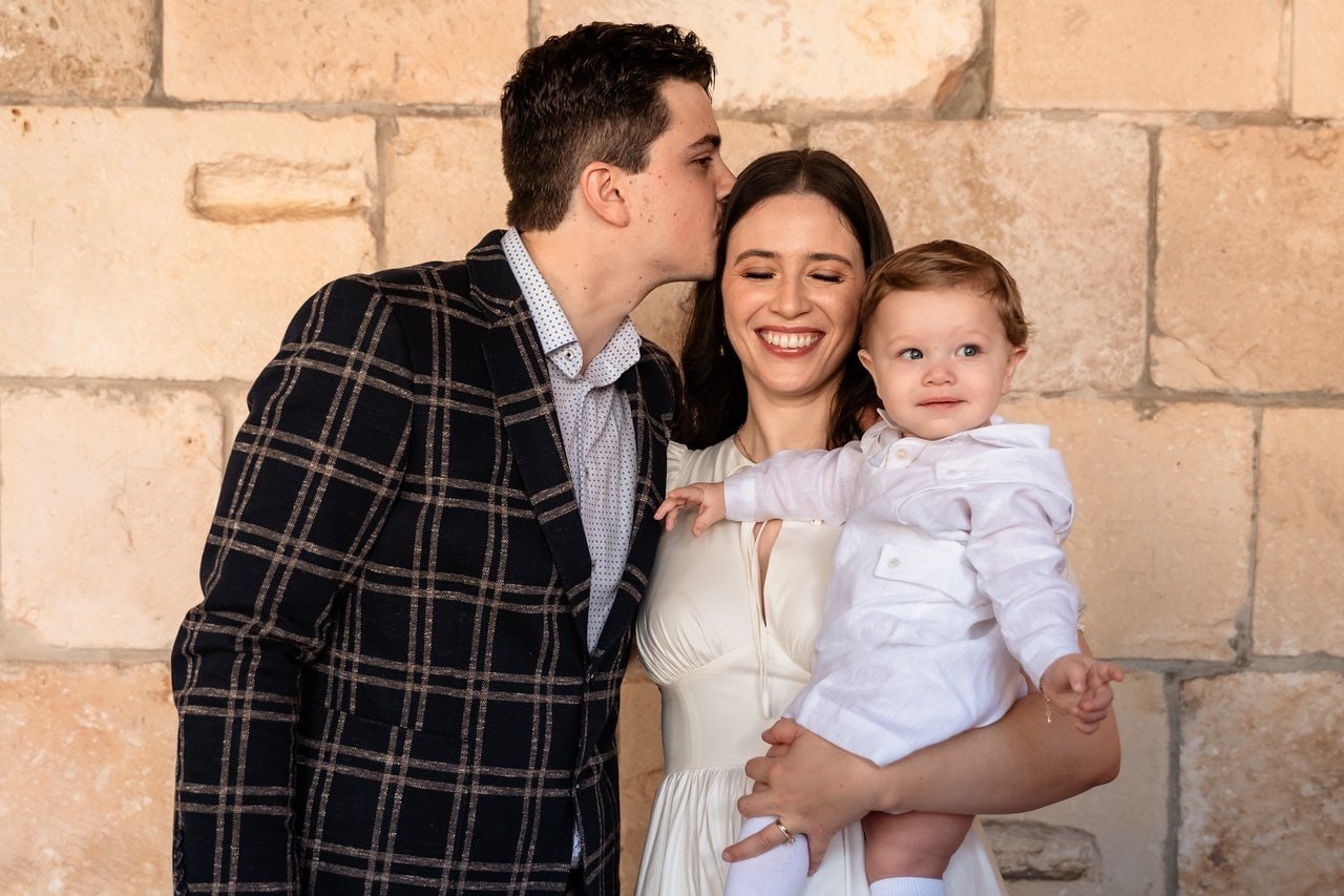 Henry with his parents during his South Florida baptism celebration